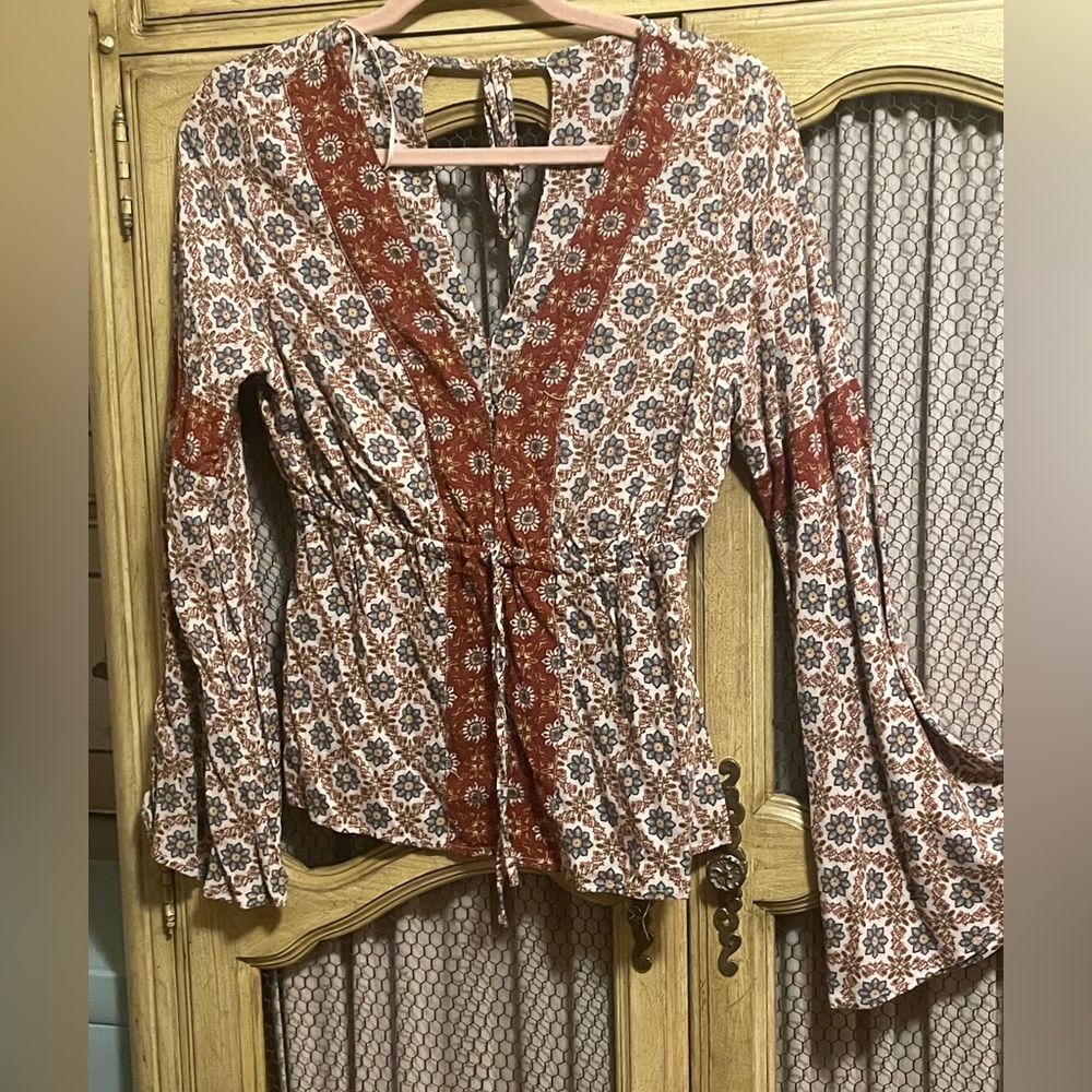 Bell sleeves, long sleeved blouse